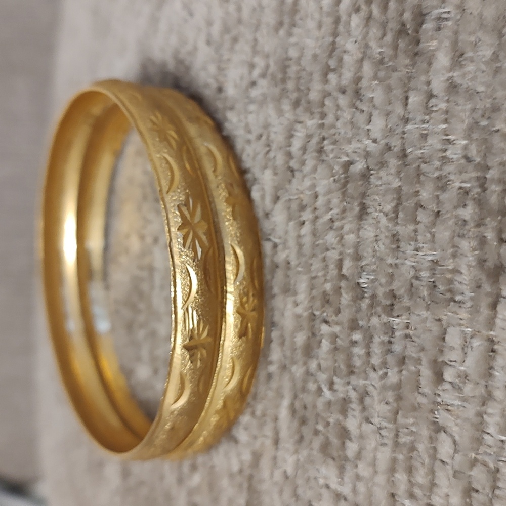 Set of Two Celestial Design Hammered Gold Tone Bangles